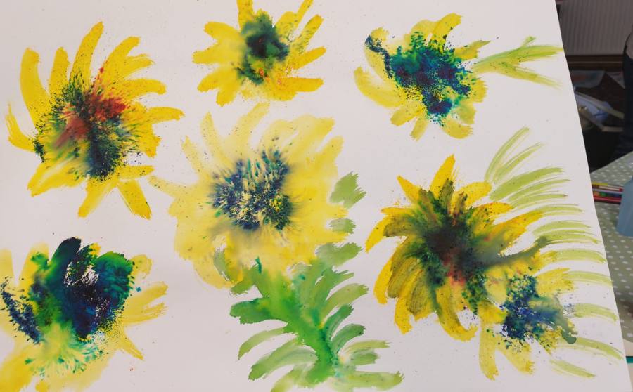 Yellow and green watercolour flowers with dark blue centres